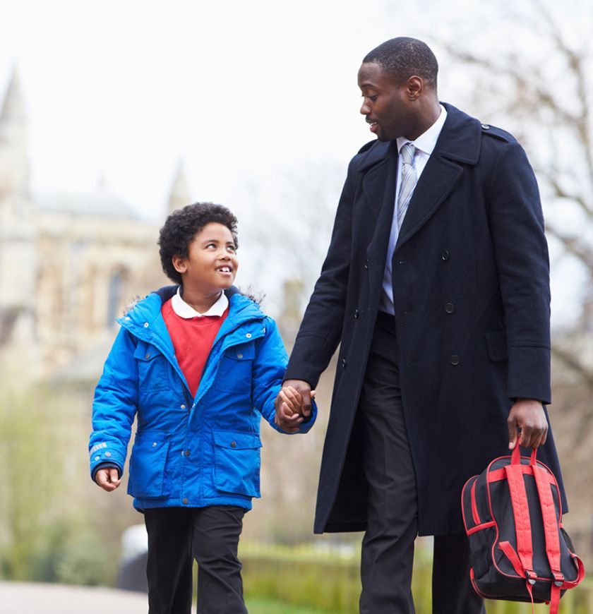 Man walking son to school