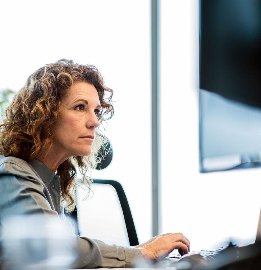 Working in front of office computer