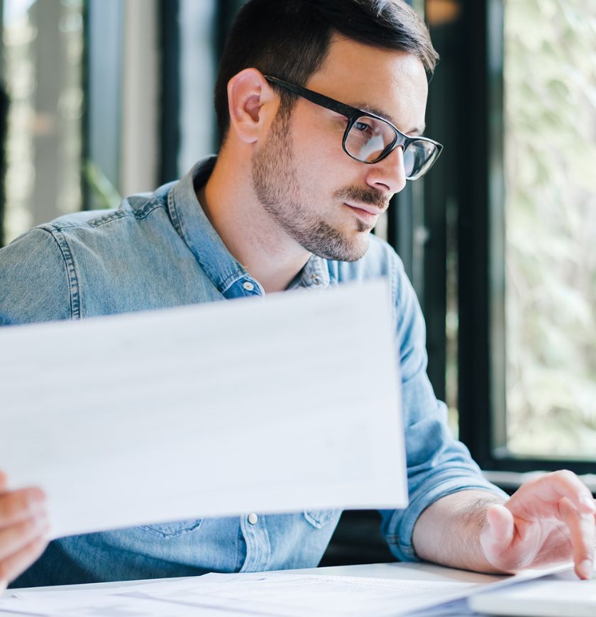 man with paperwork 