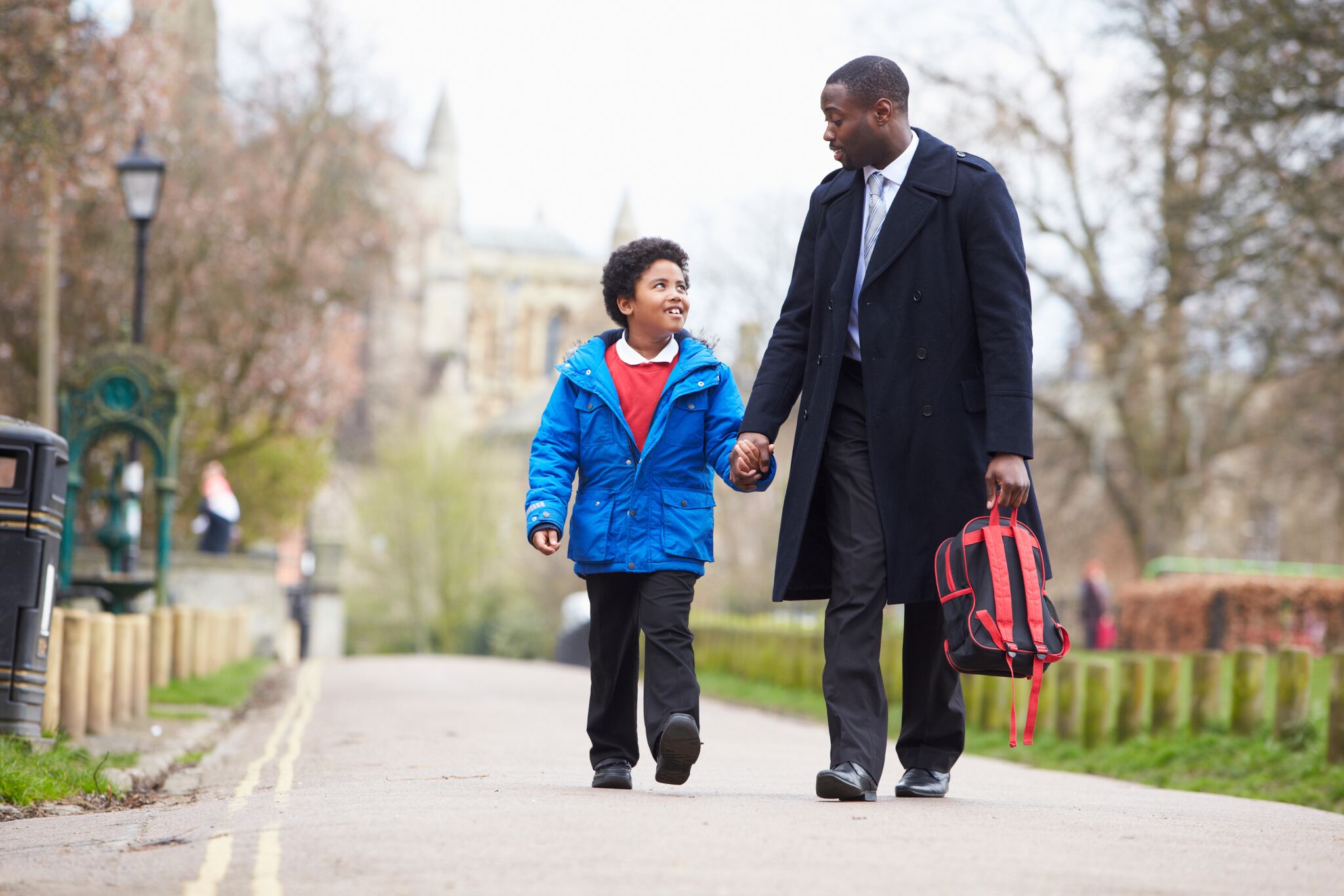 Father and son walking with each other 