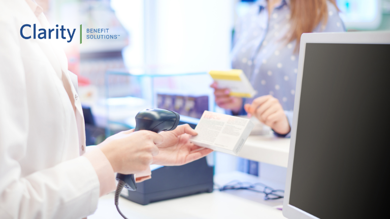 What Happens to Unused HSA Funds at Year’s End? Person using HSA card at their pharmacy