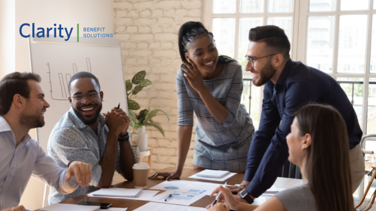 Employees navigating the benefits maze with plain language communication during open enrollment. Employees around a conference table working